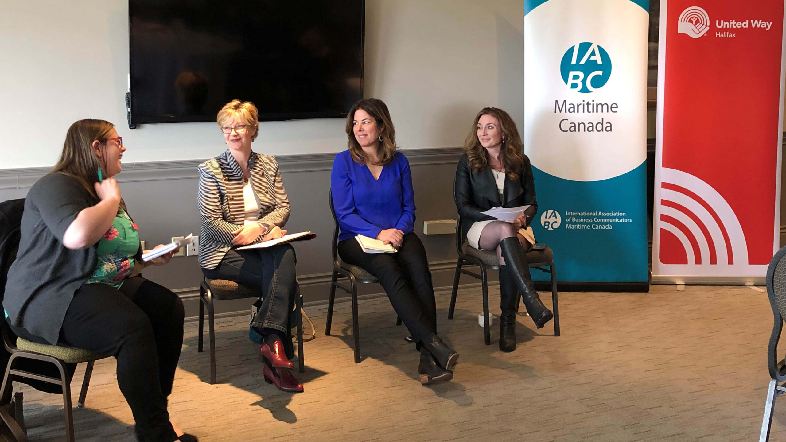 Four women sitting and talking