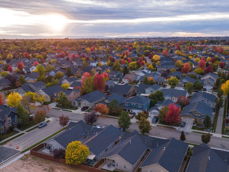 Sun setting over a suburban community in the fall.