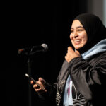 Spoken word performer General Kahn delivering her spoken word piece