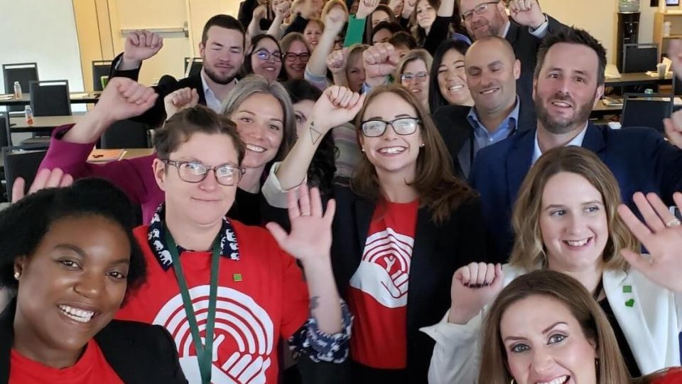 A large group of United Way Halifax and TD Bank Group employees posing for a group selfie