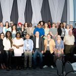 Large group of people standing on a stage