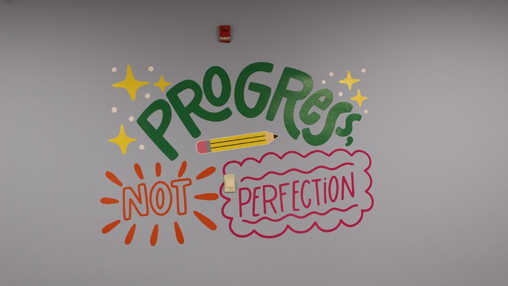 a wall mural that says