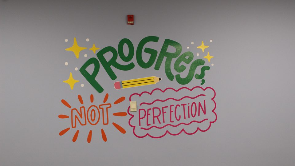 a wall mural that says 
