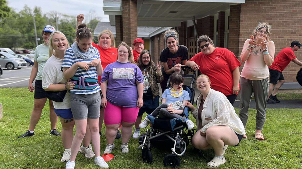 A group of people standing outside a building