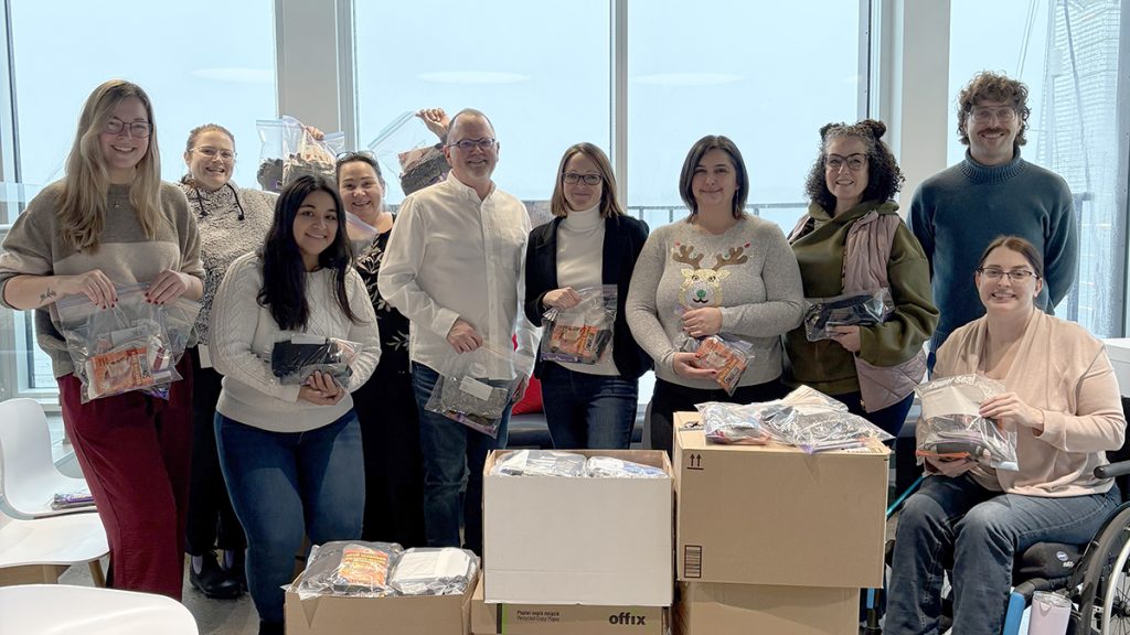 Staff from Stewart McKelvey packed winter warming kits for people experiencing homelessness.