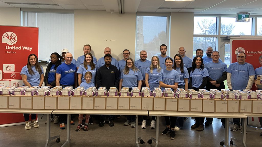 Highliner Seafood employees packed many meal kits for people experiencing food insecurity.